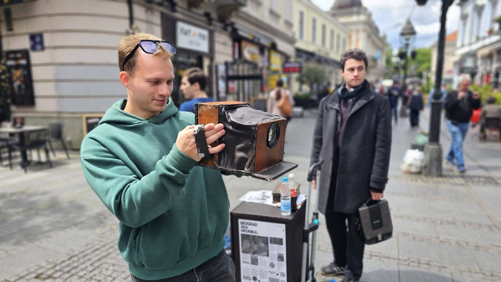RID Studio photographer with the vintage-style camera on Knez Mihailova